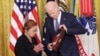 Loretta Orig accepts the Medal of Honor posthumously on behalf of her brother, Private Bruno R. Orig, from President Joe Biden during a ceremony at the White House in Washington, Jan. 3, 2025. 