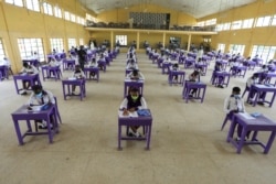 FILE - Students of Government Secondary School Wuse are seen taking the West African Examination Council 2020 exam, after the coronavirus disease lockdown in Abuja, Nigeria, Aug. 17, 2020.