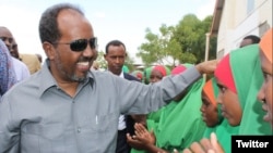 Somali President Hassan Sheikh Mohamud is greeted by children at Dadaab refugee camp in eastern Kenya, June 6, 2016. The camp, established in the early 1990s, houses more than 300,000 displaced Somalis. (via @TheVillaSomalia)