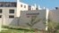 FILE - This Aug. 24, 2018, file photo taken from video shows the exterior of the Steigenberger Aqua Magic Hotel in Hurghada, Egypt. Egypt's chief prosecutor said Sept. 12, 2018, that tests showed that E.coli bacteria were behind the deaths of two British tourists in the hotel in the Red Sea resort of Hurghada.