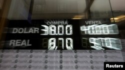 An electronic board shows currency exchange rates, in Buenos Aires' financial district in Argentina, Sept. 4, 2018.