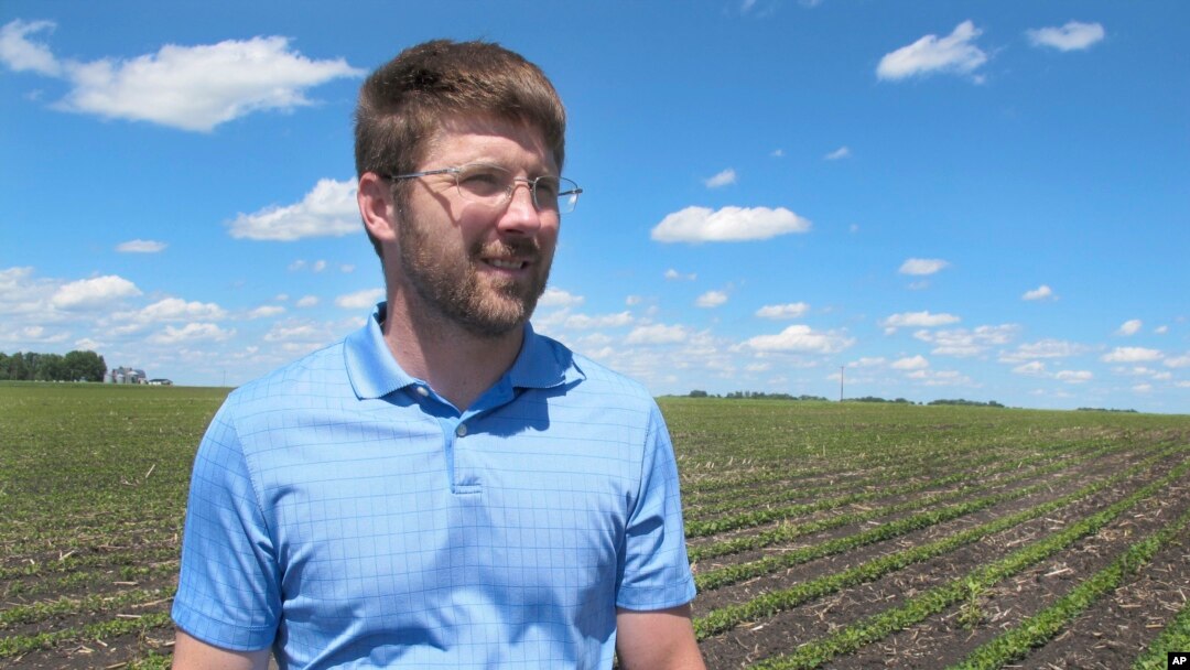 Farmer Matthew Keller walks in his soybean field near Kenyon, Minnesota, June 25, 2019.