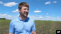 Farmer Matthew Keller walks in his soybean field near Kenyon, Minnesota, June 25, 2019.