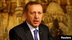 FILE - Turkey's Prime Minister Tayyip Erdogan speaks during a press conference. 