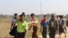 Residents carrying a body of an ethnic Rakhine woman for burial in Rathedaung township after fresh fighting in Rakhine state between the Myanmar military and the Arakan Army, an ethnic Rakhine force, Feb. 21, 2019.