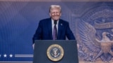 US President Donald Trump is seen on a large screen during his address by video conference at the World Economic Forum (WEF) annual meeting in Davos on January 23, 2025.