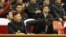 North Korean leader Kim Jong Un, left, and former NBA star Dennis Rodman watch North Korean and U.S. players in an exhibition basketball game, Pyongyang, Feb. 28, 2013.