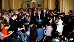 Senate Majority Leader Mitch McConnell of Kentucky, center, speaks during a news conference on Capitol Hill in Washington, July 18, 2017.