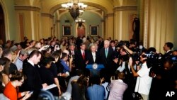 Senate Majority Leader Mitch McConnell of Kentucky, center, speaks during a news conference on Capitol Hill in Washington, July 18, 2017.