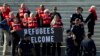 Faith leaders and members of human rights groups wearing a life vests symbolizing the life-saving program are arrested by Capitol police, during a protest calling on congress not to end the refugee resettlement program, at the steps of the U.S. Capitol i