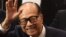 Hong Kong's richest man Li Ka-shing, 89, waves as he leaves a press conference in Hong Kong on March 16, 2018.