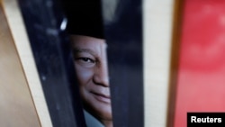 A picture of Indonesian President-elect Prabowo Subianto is seen at a stall, ahead of his inauguration, in Jakarta, Indonesia, Oct.18, 2024. 