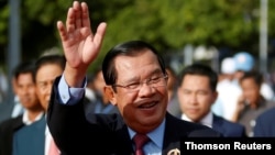 FILE - President of the ruling Cambodian People's Party and Prime Minister Hun Sen attends a ceremony to mark the 68th anniversary of the establishment of the party in Phnom Penh, Cambodia, June 28, 2019. 