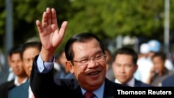 FILE - President of the ruling Cambodian People's Party and Prime Minister Hun Sen attends a ceremony to mark the 68th anniversary of the establishment of the party in Phnom Penh, Cambodia, June 28, 2019. 