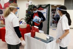 Walgreens Pharmacists prepare Pfizer-BioNTech coronavirus vaccines at Crown Heights Center for Nursing and Rehabilitation, a nursing home facility in Brooklyn, New York, Dec. 22, 2020.