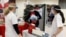 Walgreens Pharmacists prepare Pfizer-BioNTech coronavirus vaccines at Crown Heights Center for Nursing and Rehabilitation, a nursing home facility in Brooklyn, New York, Dec. 22, 2020.