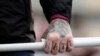 FILE - A tattoo is seen on a hand of a supporter of Italy's far-right Forza Nuova party during a demonstration in Rome, Italy, November 4, 2017.