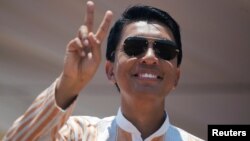 Madagascar Presidential candidate Andry Rajoelina salutes his supporters during a campaign rally at the Coliseum stadium in Antananarivo, Nov. 3, 2018.
