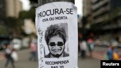 Defaced image of Brazil's President Dilma Rousseff displayed in Belo Horizonte, June 24, 2013.