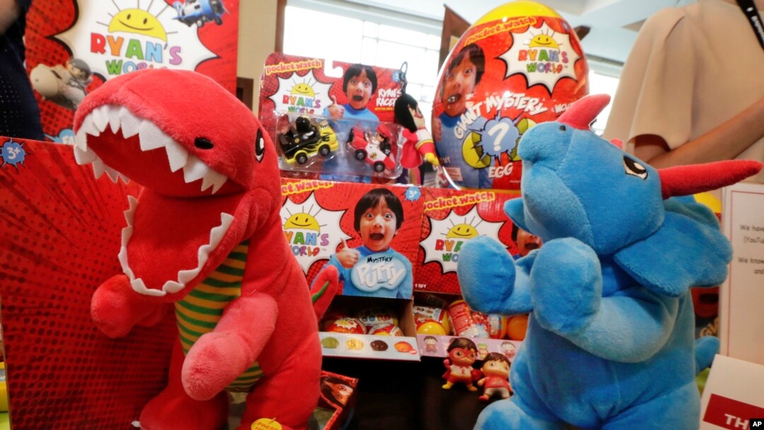 FILE - Ryan's World toys, from Bonkers Toys, are displayed at the The Toy Insider Sweet Suite show, in New York, July 11, 2018.