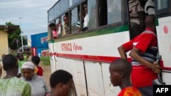 People board a bus leaving Bujumbura, Burundi, with many saying they were leaving for the countryside, citing insecurity following protests against President Pierre Nkurunziza's decision to run for a third term in the upcoming elections, May 2, 2015. 