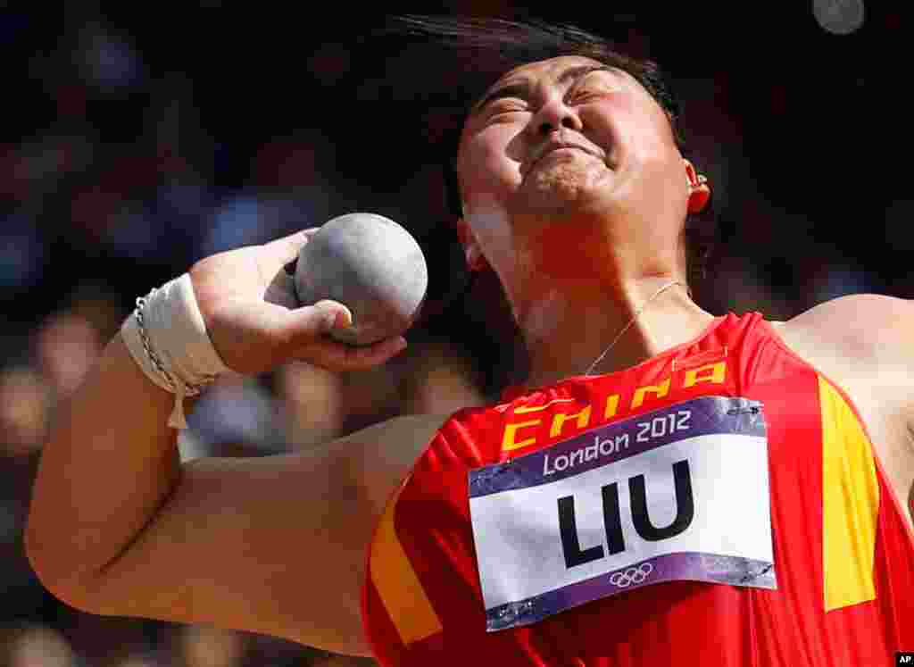 China's Liu Xiangrong performs in the women's shot put qualification round.