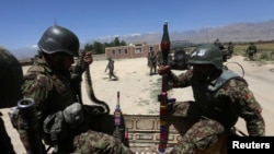 Afghan National Army soldiers patrol near polling stations in the outskirts of Kabul, June 12, 2014.