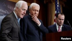 U.S. Senator John Cornyn (L), Senator Orrin Hatch (C) and Senator Mike Lee (R) discuss the FBI background investigation into the assault allegations against U.S. Supreme Court nominee Judge Brett Kavanaugh on Capitol Hill in Washington, U.S., Oct. 4, 2018.