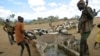 Armed Turkana guard water stations in Kenya’s lower basin where advocates of the largest desert lake in the world are alarmed that Ethiopia may reduce the lake’s levels for irrigation of upstream plantations. 