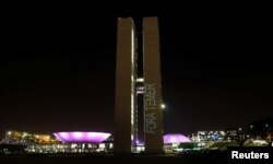 A projection with the message "Out Temer'' in reference of Brazilian President Michel Temer, is seen on the National Congress in Brasilia, Brazil, Aug. 1, 2017.