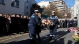 French President Macron and other officials take part in a ceremony commemorating the anniversary of an attack on Charlie Hebdo, outside the weekly's former offices in Paris, Jan. 7, 2025.