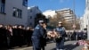 French President Macron and other officials take part in a ceremony commemorating the anniversary of an attack on Charlie Hebdo, outside the weekly's former offices in Paris, Jan. 7, 2025.