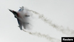 Jet tempur MiG-29 milik Rusia dalam pertunjukan udara di luar Moskow.