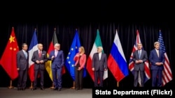 Secretary Kerry poses for a group photo with fellow EU, P5+1 foreign ministers and Iranian Foreign Minister Zarif after reaching Iran nuclear deal, in Vienna, Austria, July 14, 2015.