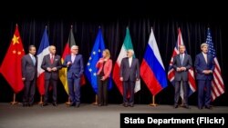 Secretary Kerry poses for a group photo with fellow EU, P5+1 foreign ministers and Iranian Foreign Minister Zarif after reaching Iran nuclear deal, in Vienna, Austria, July 14, 2015.