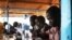 FILE - Displaced South Sudanese students take a math examination at a United Nations base in Juba, Jan. 17, 2014.