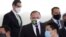 Brazil's Health Minister Gen. Eduardo Pazuelo, center, arrives to attend a ceremony at the Planalto Presidential Palace, in Brasilia, Brazil, Sept. 16, 2020. 