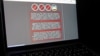 FILE - A laptop screen displays a warning message in Ukrainian, Russian and Polish that appeared on the official website of the Ukrainian Foreign Ministry after a massive cyberattack, Jan. 14, 2022. 