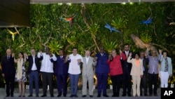 Leaders pose for a group photo during the Amazon Summit at the Hangar Convention Center in Belem, Brazil, Wednesday, Aug. 9, 2023. (AP Photo/Eraldo Peres)