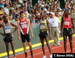 U.S. Army Spc. Paul Chelimo acknowledges the crowd as he is introduced before the 5,000-meter race at the 2016 U.S. Olympic Track and Field Team Trials.