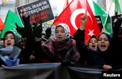 FILE - Demonstrators shout slogans during a protest against Iran's role in Aleppo, Syria, near the Iranian Consulate in Istanbul, Turkey, Dec. 16, 2016. The conflicts in Syria and Iraq have further chrystalized differences between Turkey and Iran both of which jockey for influence in the region.