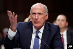 FILE - Director of National Intelligence Dan Coats speaks during a Senate Intelligence Committee hearing about the Foreign Intelligence Surveillance Act, June 7, 2017, in Washington.