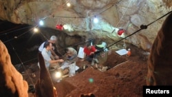 Researchers work inside Manot Cave in Israel's Western Galilee in this picture released Jan. 28, 2015. 
