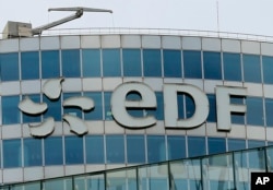 FILE - The EDF tower of French state-owned power giant Electricite de France (EDF), is seen in the La Defense business district, west of Paris.