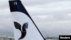 A logo of IranAir is shown on an Airbus A321 as the company takes delivery of the first new Western jet under an international sanctions deal, Jan. 11, 2017.