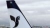 A logo of IranAir is shown on an Airbus A321 as the company takes delivery of the first new Western jet under an international sanctions deal, Jan. 11, 2017.