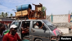 People flee their homes amid gang violence, in Port-au-Prince, Haiti, Oct. 20, 2024.