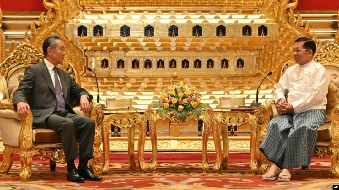 Myanmar's military leader, Senior Gen. Min Aung Hlaing, right, talks with Chinese Foreign Minister Wang Yi on Aug. 14, 2024, in Naypyitaw, Myanmar. (Myanmar Military Information Team via AP)