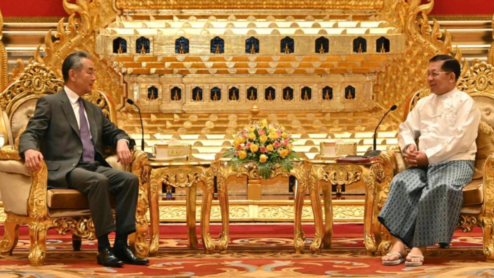 Myanmar's military leader, Senior Gen. Min Aung Hlaing, right, talks with Chinese Foreign Minister Wang Yi on Aug. 14, 2024, in Naypyitaw, Myanmar. (Myanmar Military Information Team via AP)