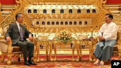 Myanmar's military leader, Senior Gen. Min Aung Hlaing, right, talks with Chinese Foreign Minister Wang Yi on Aug. 14, 2024, in Naypyitaw, Myanmar. (Myanmar Military Information Team via AP)